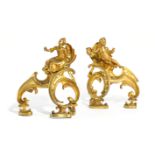 A PAIR OF FRENCH ORMOLU CHENETS IN LOUIS XV STYLE AFTER PHILLIPE CAFFIERI, MID-19TH CENTURY modelled