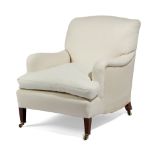 AN EDWARDIAN EASY ARMCHAIR BY HOWARD & SONS, EARLY 20TH CENTURY on mahogany square tapering front