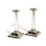 A PAIR OF LATE VICTORIAN SILVER CANDLESTICKS BY MARTIN, HALL AND COMPANY, SHEFFIELD, 1897 with