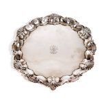 A GEORGE V SILVER SALVER BY SEBASTIAN GARRARD, LONDON, 1912 of circular form, with a shell and