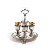 A VICTORIAN SILVER SIX EGG-CUP CRUET FRAME BY ROBERT HENNELL, LONDON, 1863 of circular form, with