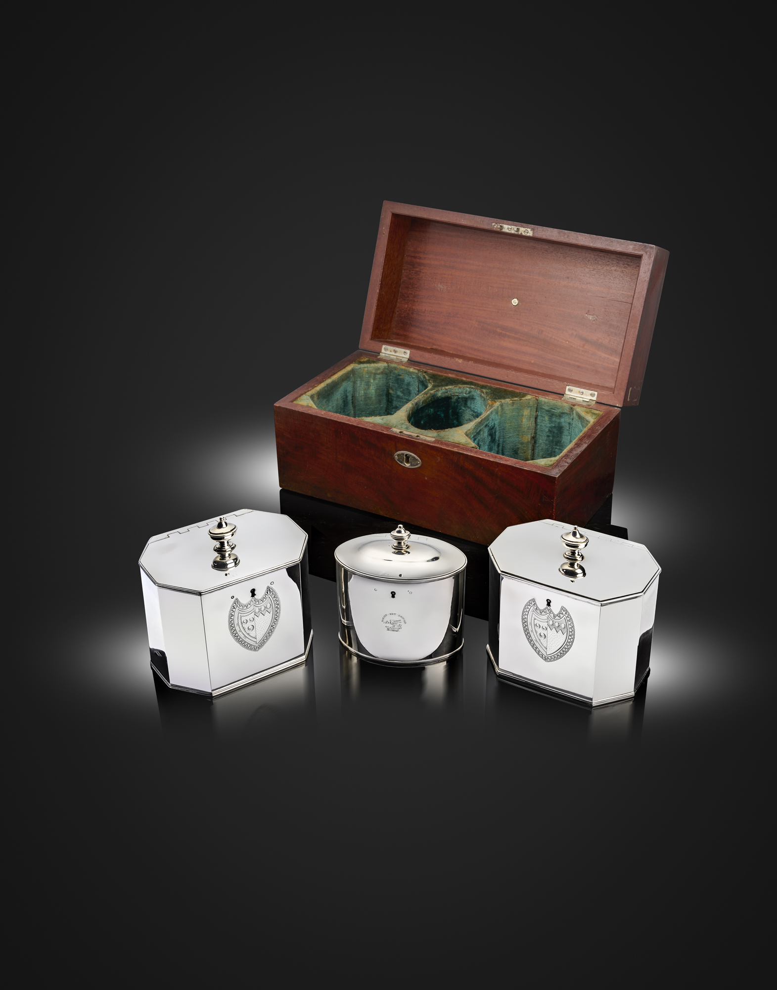 A matched suite of three George III silver tea caddies, one by John Edwards, London 1801, one by