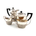 A matched four-piece silver tea set, by the Barker Brothers, Birmingham 1937-1940, oval form, part-