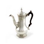 A George III silver coffee pot, by Benjamin Gignac, London 1765, baluster form, scroll handle,