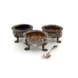 A set of three George IV silver salt cellars, by James Le Bas, Dublin 1824, retailed by Law, heavy