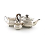 A three-piece late-Victorian silver bachelor's tea set, by H. Atkins, Sheffield 1894/95, oblong