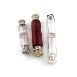 A Victorian silver-gilt mounted red glass double-ended scent bottle, unmarked, faceted cylindrical
