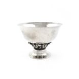 A silver bowl in the Georg Jensen manner, marked sterling and with an unidentified maker's stamp,