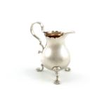 A George II silver cream jug, by George Greenhill Jones, London 1737, baluster form, wavy edge