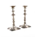 A pair of Edwardian silver candlesticks, by Israel Sigmund Greenberg, Birmingham 1905, in the George