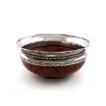 By Leslie Durbin, an Arts and Crafts silver-mounted wooden mazer bowl, London 1950, circular form,