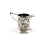 Designed by Kate Harris for W. G. Connell, a late Victorian Art Nouveau silver cream jug, London