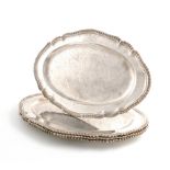 A set of four George III silver meat platters, by Frederick Kandler, London 1761, shaped oval