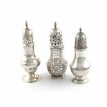 A small collection of three antique silver casters, comprising: a George I one, by Thomas Bamford,
