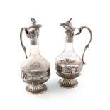 A pair of French silver-mounted glass claret jugs, by E. Puiforcat, Paris circa 1900-1920,