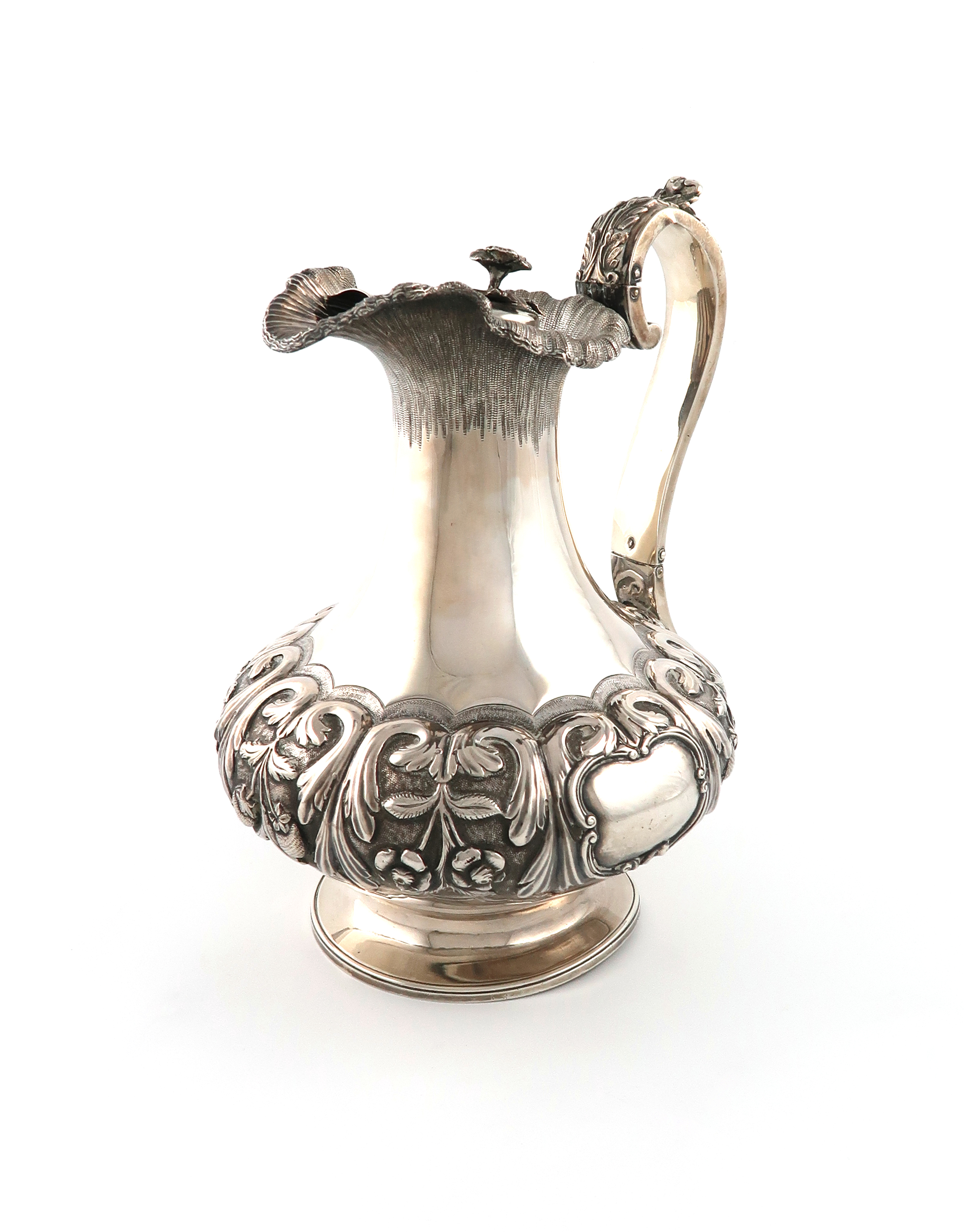 An early Victorian Irish silver hot water ewer, no apparent maker's mark, Dublin 1837, lobed