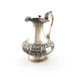 An early Victorian Irish silver hot water ewer, no apparent maker's mark, Dublin 1837, lobed