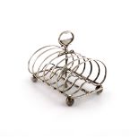 A Victorian silver seven-bar toast rack, by Charles & George Fox, London 1846, kidney-shaped bars,