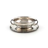 Designed by Harald Nielson for Georg Jensen, a Danish christening bowl and stand, design number 456,