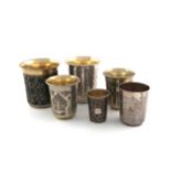 A collection of six Russian silver beakers, including a 19th century silver-gilt and niello one,