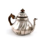 A 19th century silver teapot, marked 12 and maker's mark of 'I.? over H', probably German,