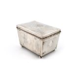 By Hugh Wallis, an Arts and Crafts silver casket, Chester 1923, tapering rectangular form, shaped