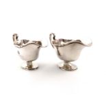 A pair of silver sauce boats, by Atkin Brothers, Sheffield 1929/30, oval form, moulded border,