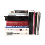 A quantity of reference books and publications relating to wine labels and silver, including: