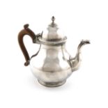 A silver teapot, by Charles Stuart Harris, London 1925, baluster pear form, scroll handle, domed