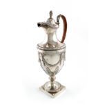 A George III silver ewer, by Henry Green, London 1777, vase form, leaf capped wicker-bound scroll