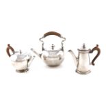 A miniature silver coffee pot, teapot and kettle, by Wakely and Wheeler, London 1927, comprising: