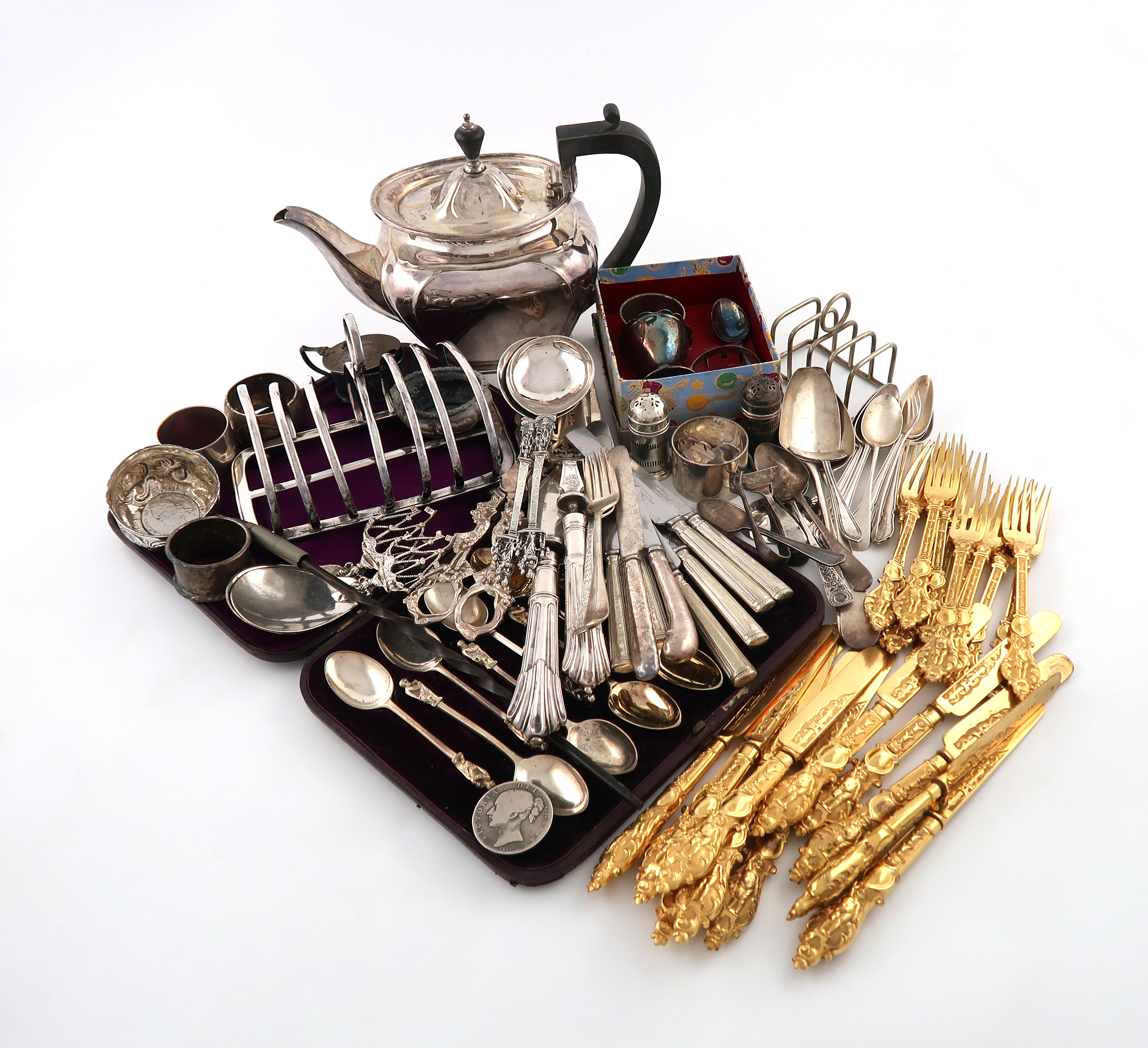 λA mixed lot, comprising silver items: two spoons with galleon handles, two tablespoons, nine