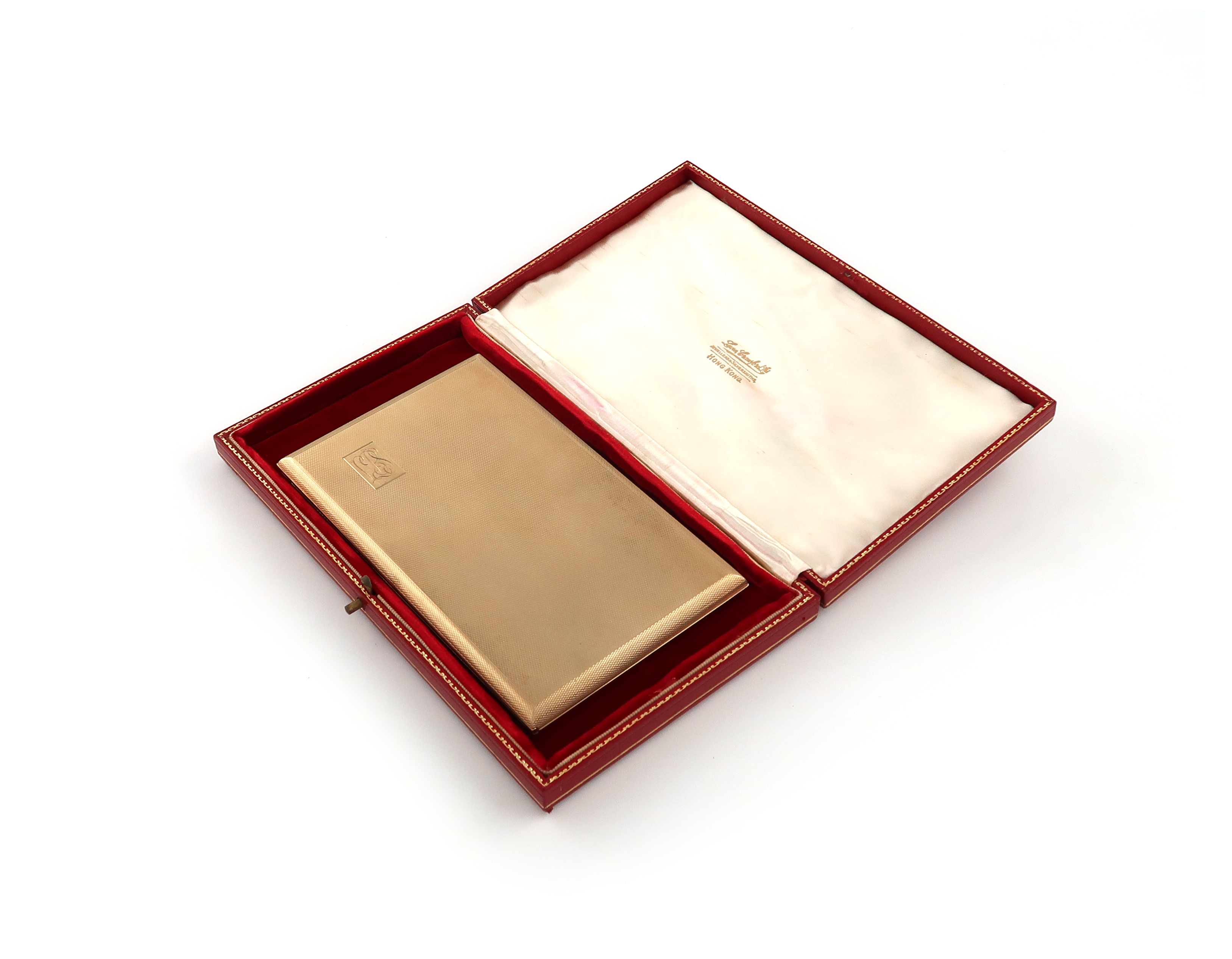 A 9 carat gold presentation cigarette case, maker's mark of KW, London 1955, retailed by Lane,