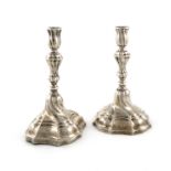 A pair of late 18th century German silver candlesticks, maker's mark possibly GCB conjoined,