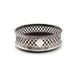 A George III silver wine coaster, marks worn, circular form, pierced with trellis decoration, reeded