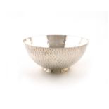 An Edwardian silver bowl, by Charles Edwards, London 1909, circular form, spot hammered