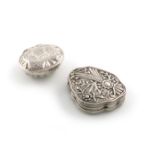 Two unmarked silver boxes, late 18th/19th century, one of cartouche form, chased foliate