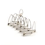 A George III silver seven-bar concertina toast rack, by Samuel Roberts, George Cadman & Co,