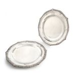 A pair of George III silver plates, by Paul Storr, London 1814 circular form, gadroon border,