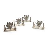A set of four Regimental silver menu card holders, The Royal Welsh Fusiliers, by Stokes and Ireland,