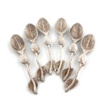 A modern set of six silver naturalistic teaspoons, by London Assay Office, London 2003, the bowls