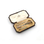 Retailed by Asprey, a silver-gilt sewing set, with import marks for London 1932, engine-turned