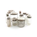 A collection of nine silver-mounted and dressing table jars, various dates and makers, various