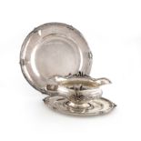 A French silver double-lipped sauce boat and platter, by E. Puiforcat, Paris, circa 1900-1920,