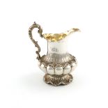 A William IV silver cream jug, by The Barnards, London 1833, lobed baluster form, with rocaille