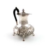 An Edwardian silver small hot water pot/ewer, by Walker & Hall, Sheffield 1905, baluster form,