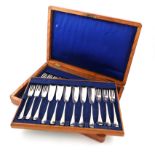 A Victorian set of twelve silver Hanoverian pattern fish knives and forks, by Atkin Bros,