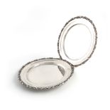 A pair of Egyptian silver plates, post 1946, circular form, foliate scroll borders, diameter 22.5cm,