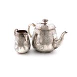 λA Victorian silver teapot and cream jug, by Stephen Smith, London 1869, tapering circular form,