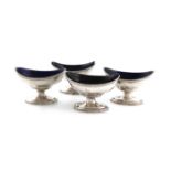 A set of four George III silver salt cellars, over-stamped with maker's mark of Thomas Wallis,